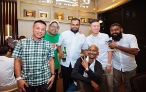 Guests taking the opportunity to pose with Chef Mano Thevar