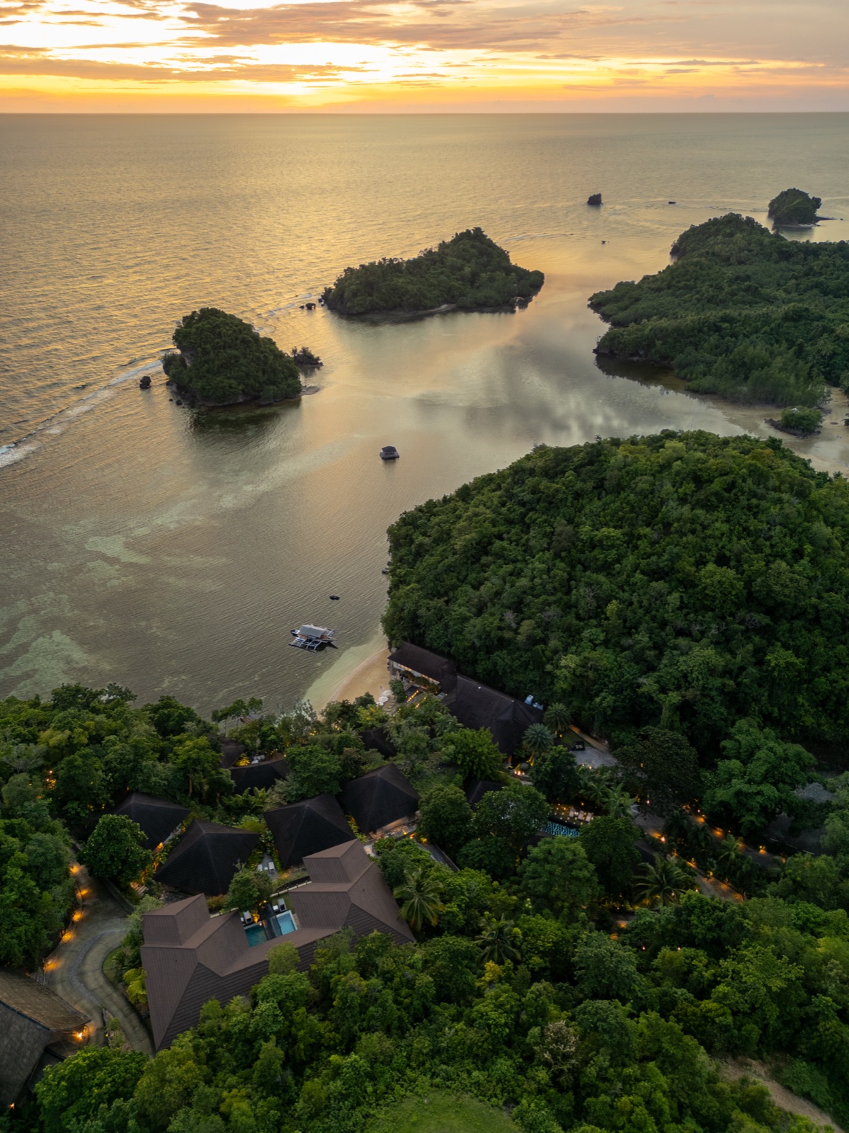 A sunset aerial view of Manami Resort in Sipalay