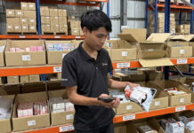 Ninja Van Malaysia Accelerates Warehouse Operations and Fulfillment Speed with Zebra Technologies Ninja Van Malaysia warehouse staff using a Zebra handheld device to scan parcels on storage shelves