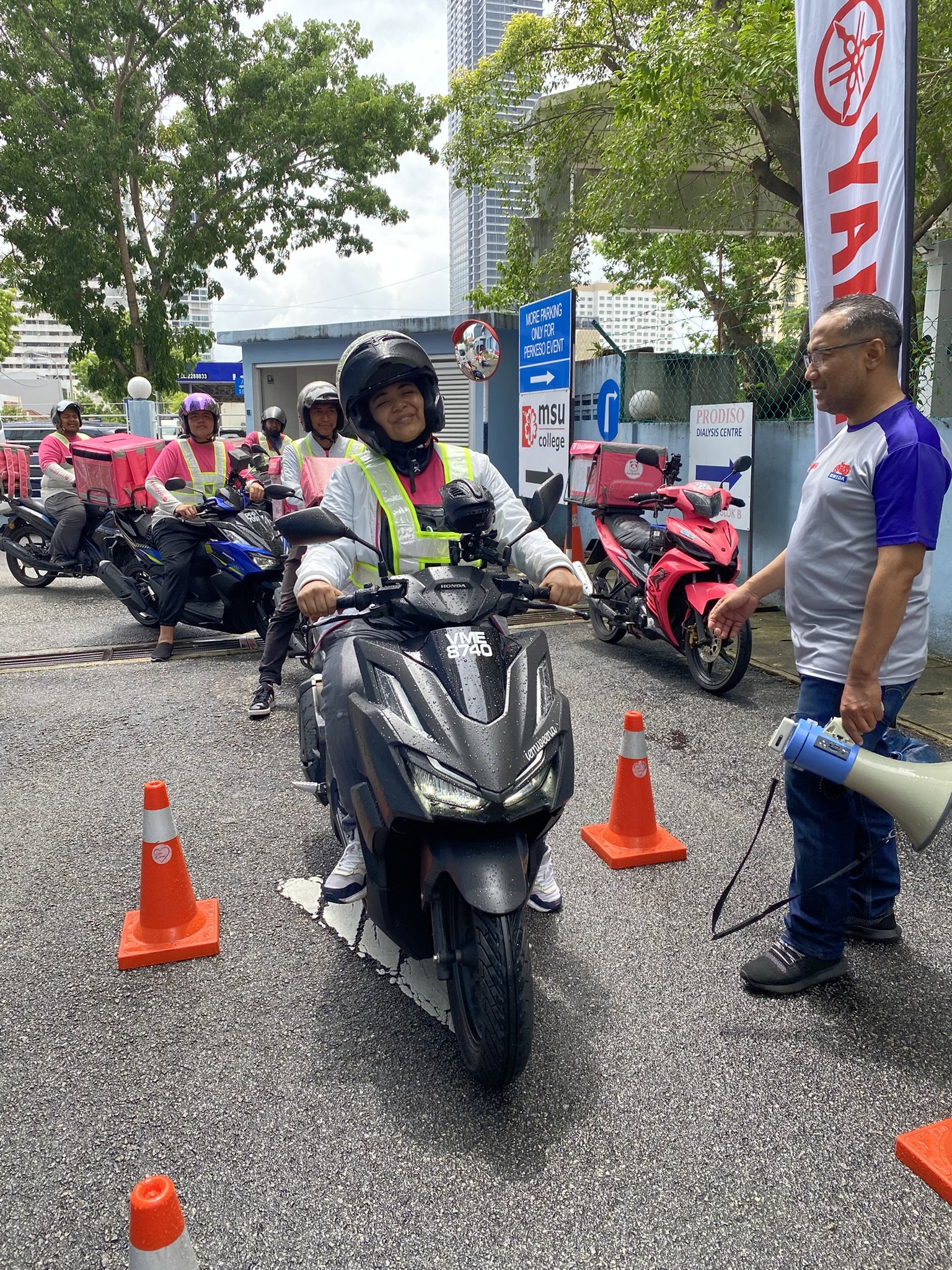 Delivery partners take part in pandasafe practical road-safety training in Penang